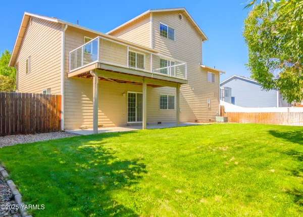 a view of a backyard of the house