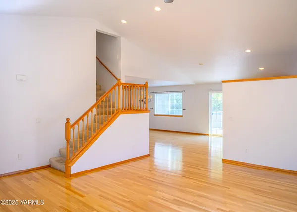 a view of an entryway with wooden floor