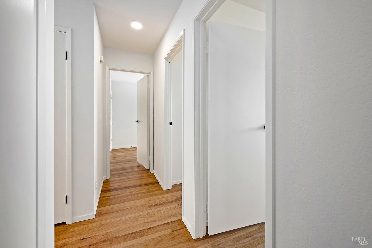 35 Salvador Way San Rafael, CA 94903 - Photo 19 of 46 a view of a hallway with wooden floor
