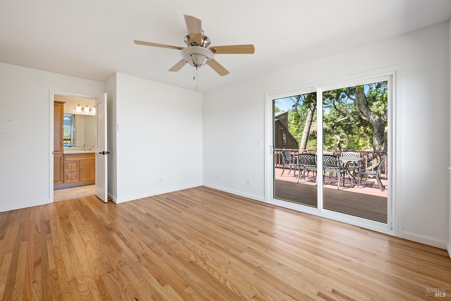 35 Salvador Way San Rafael, CA 94903 - Photo 24 of 46 a view of an empty room with a window and wooden floor