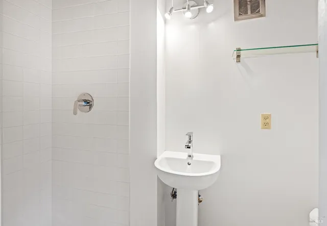 a view of a room with wooden floor and windows