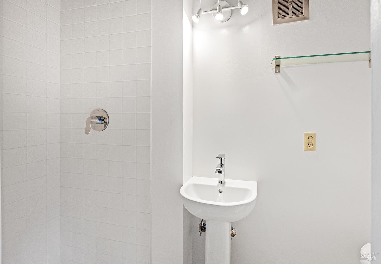 35 Salvador Way San Rafael, CA 94903 - Photo 31 of 46 a bathroom with a sink a shower and a mirror