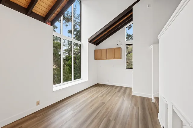 a view of cabinets and wooden floor