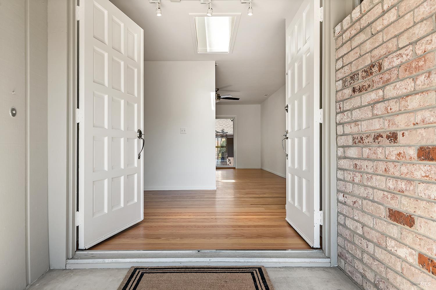 35 Salvador Way San Rafael, CA 94903 - Photo 4 of 46 a view of a hallway with wooden floor and staircase