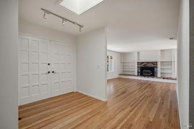 a view of a livingroom with wooden floor