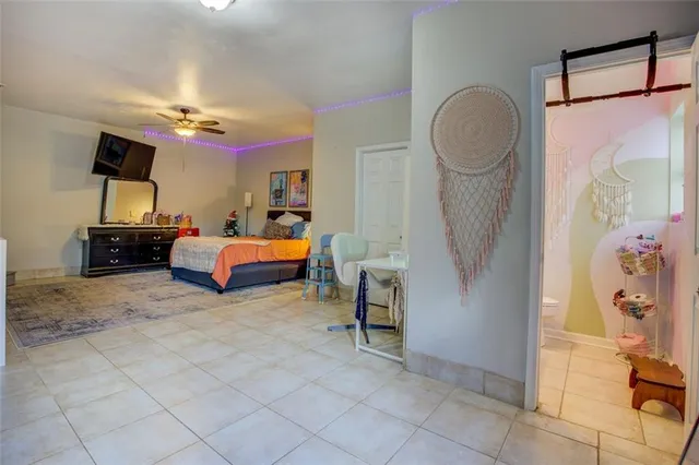 a bedroom with furniture and a window