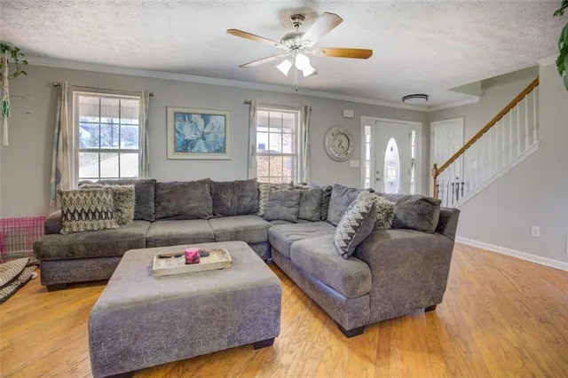 a living room with furniture and a window