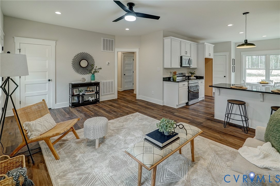 1343 Stokes Station Road Goochland, VA 23063 - Photo 12 of 35 a living room with furniture and kitchen view