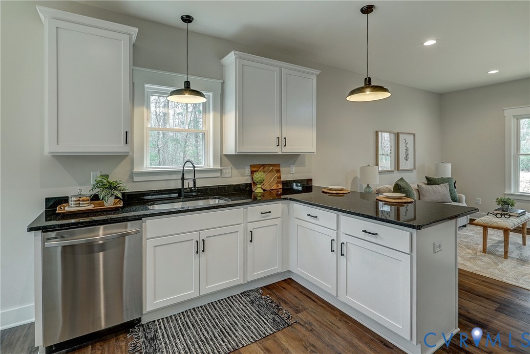 1343 Stokes Station Road Goochland, VA 23063 - Photo 16 of 35 a kitchen with granite countertop a sink and cabinets