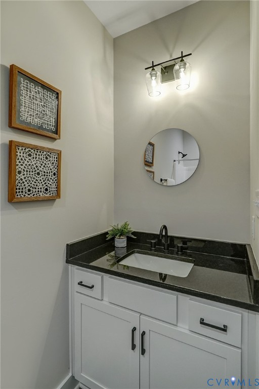 1343 Stokes Station Road Goochland, VA 23063 - Photo 23 of 35 a bathroom with a sink and a mirror