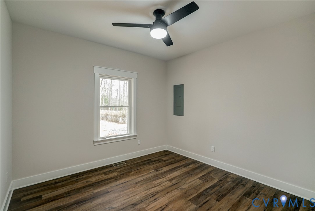 1343 Stokes Station Road Goochland, VA 23063 - Photo 27 of 35 wooden floor in an empty room with a window