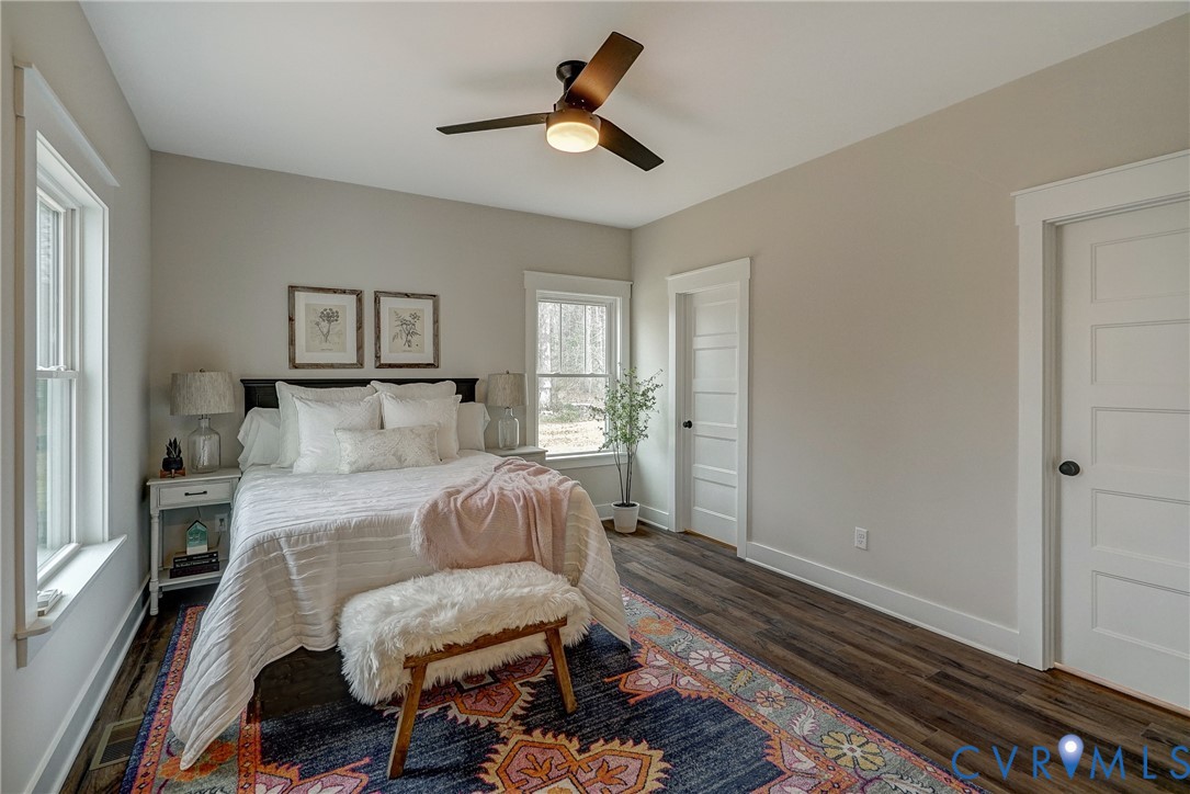 1343 Stokes Station Road Goochland, VA 23063 - Photo 30 of 35 a bedroom with a bed and wooden floor