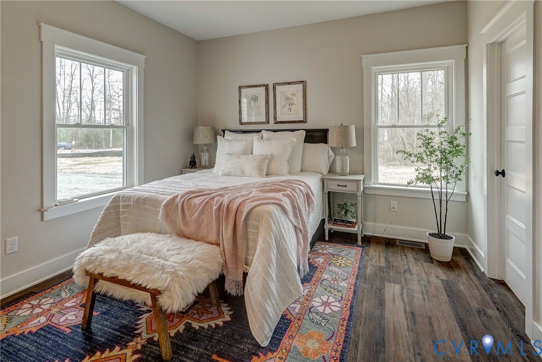 1343 Stokes Station Road Goochland, VA 23063 - Photo 31 of 35 a bedroom with a bed and wooden floor