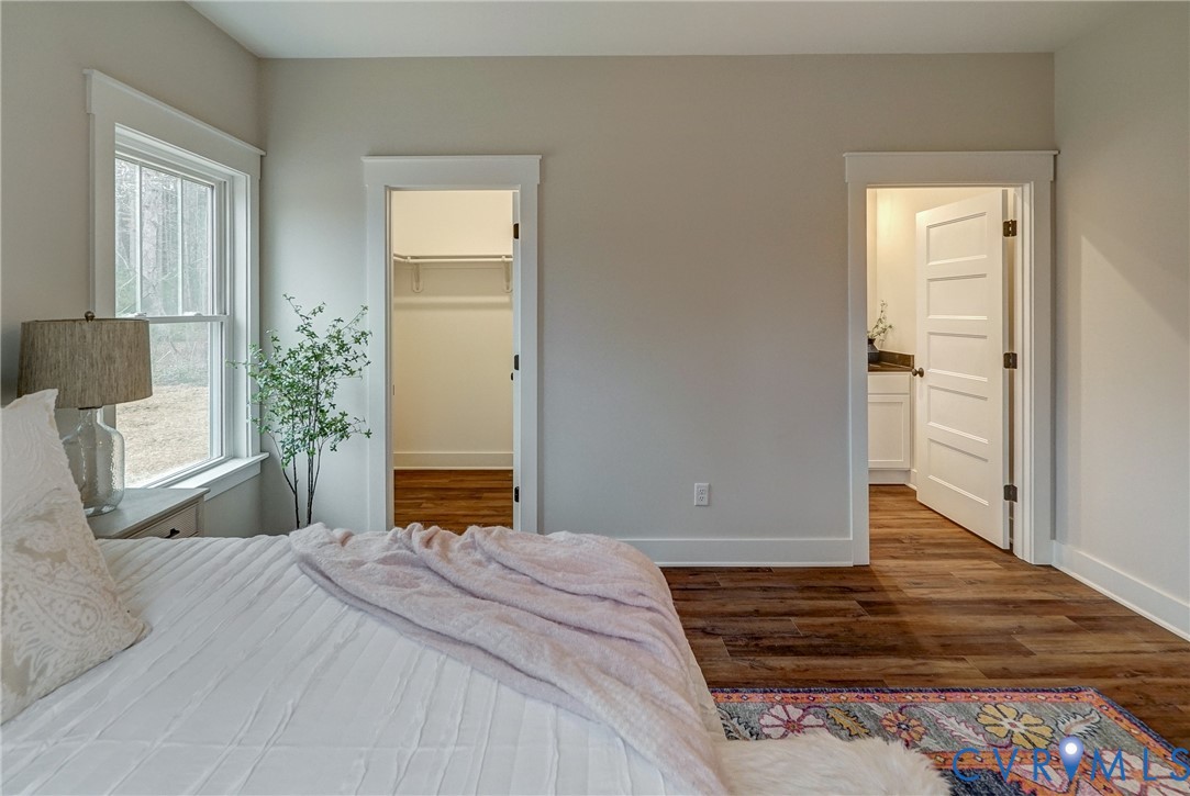 1343 Stokes Station Road Goochland, VA 23063 - Photo 32 of 35 a bedroom with a bed and wooden floor