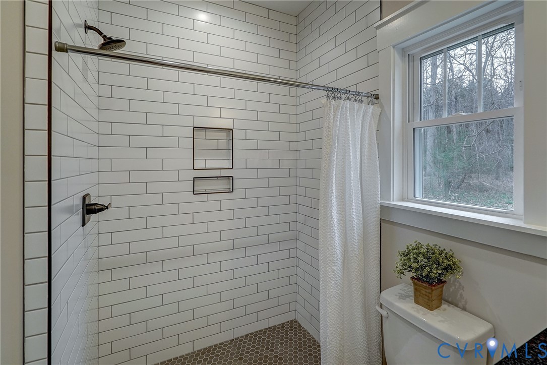 1343 Stokes Station Road Goochland, VA 23063 - Photo 35 of 35 a bathroom with a shower and a sink
