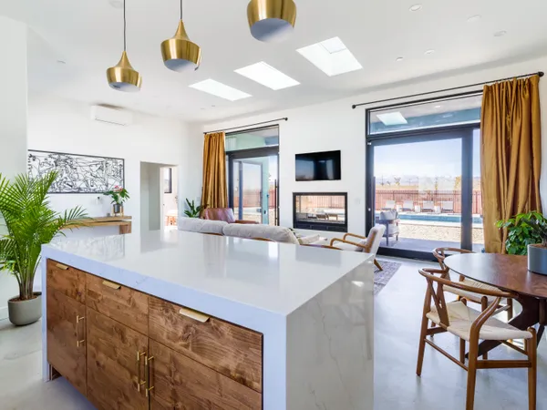 a kitchen with stainless steel appliances a sink stove and cabinets