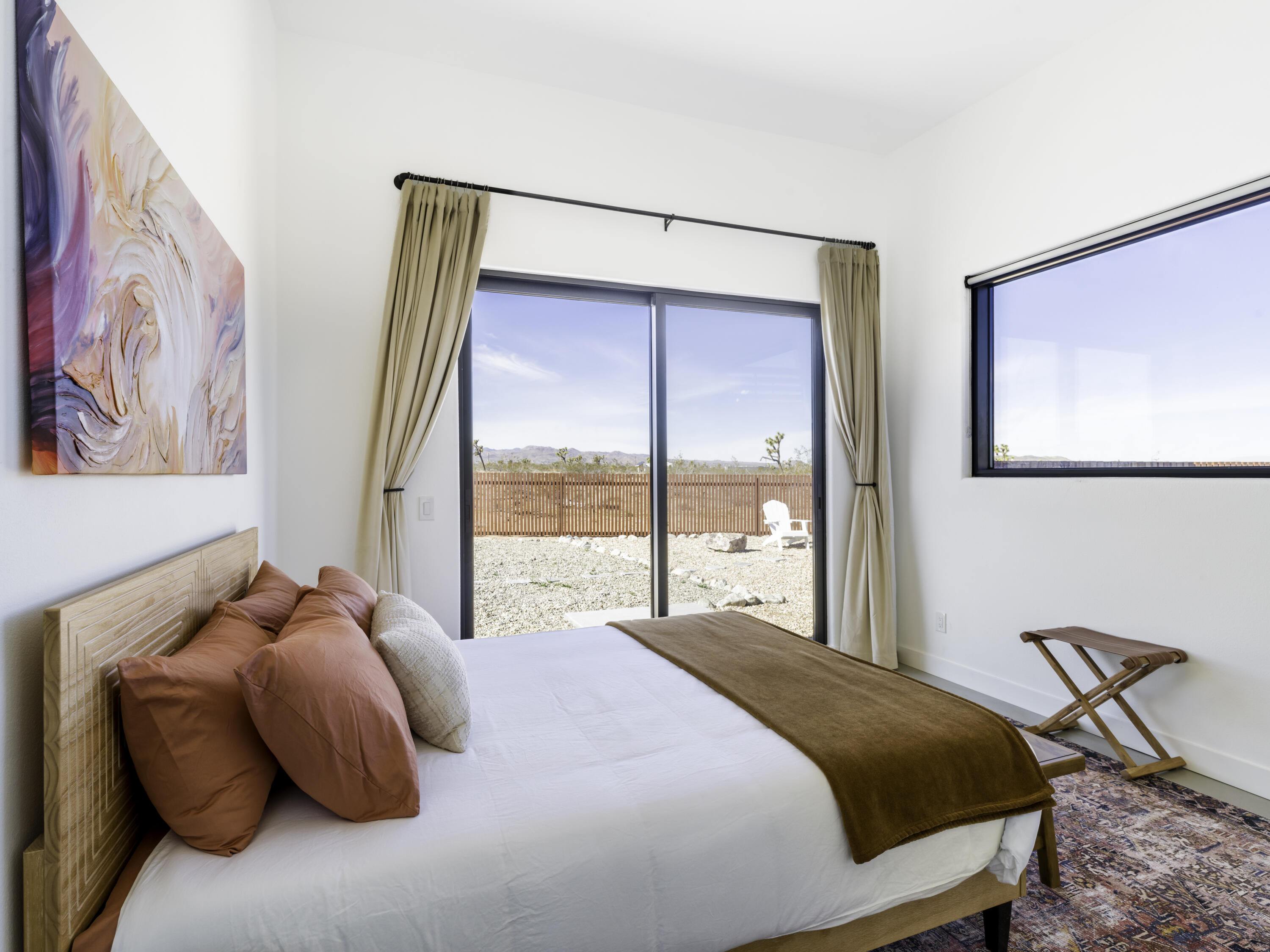 59130 Reche Road Landers, CA 92285 - Photo 25 of 69 a bedroom with a bed and a painting on the wall