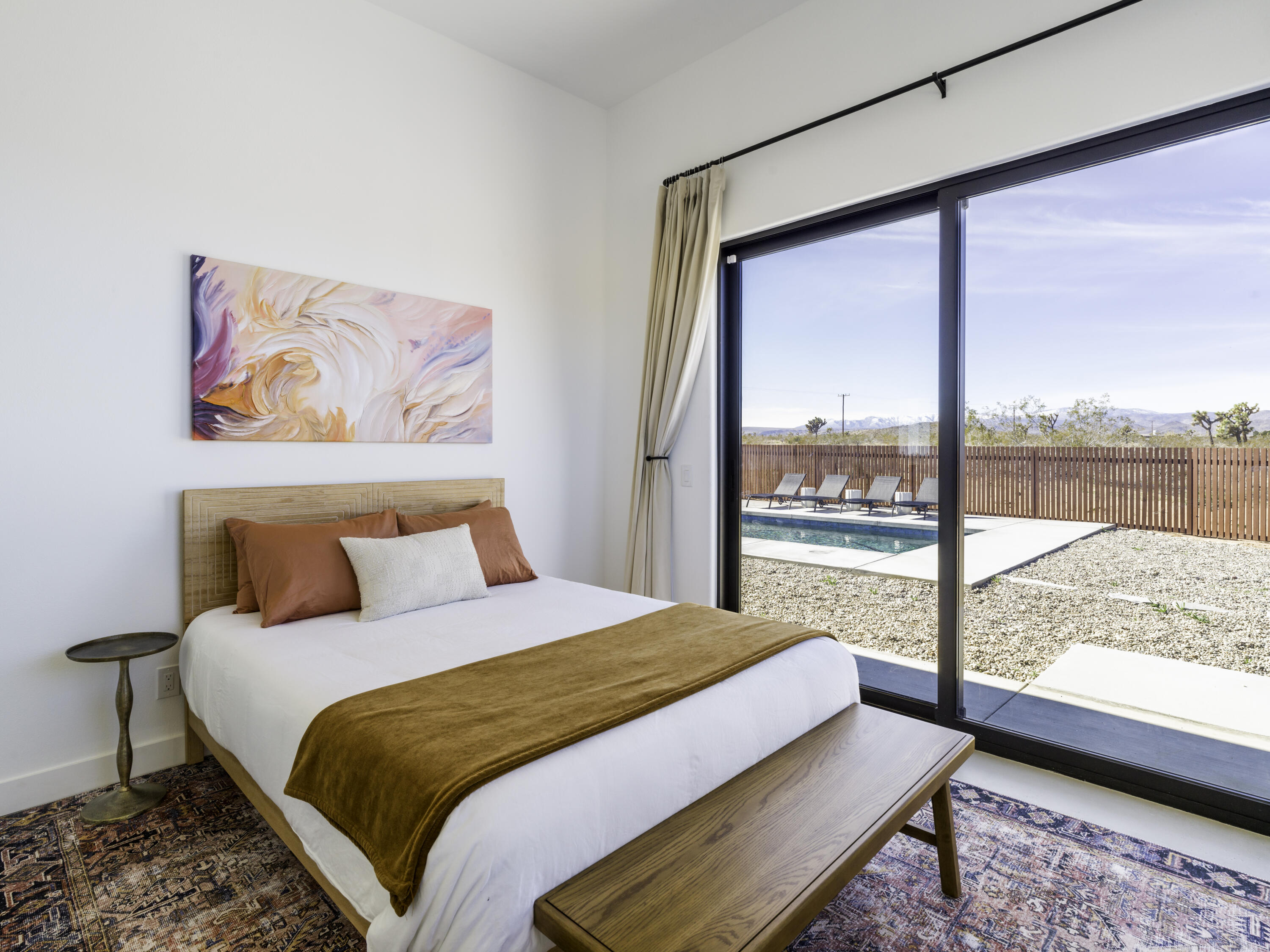 59130 Reche Road Landers, CA 92285 - Photo 26 of 69 a bedroom with a large window and a bed