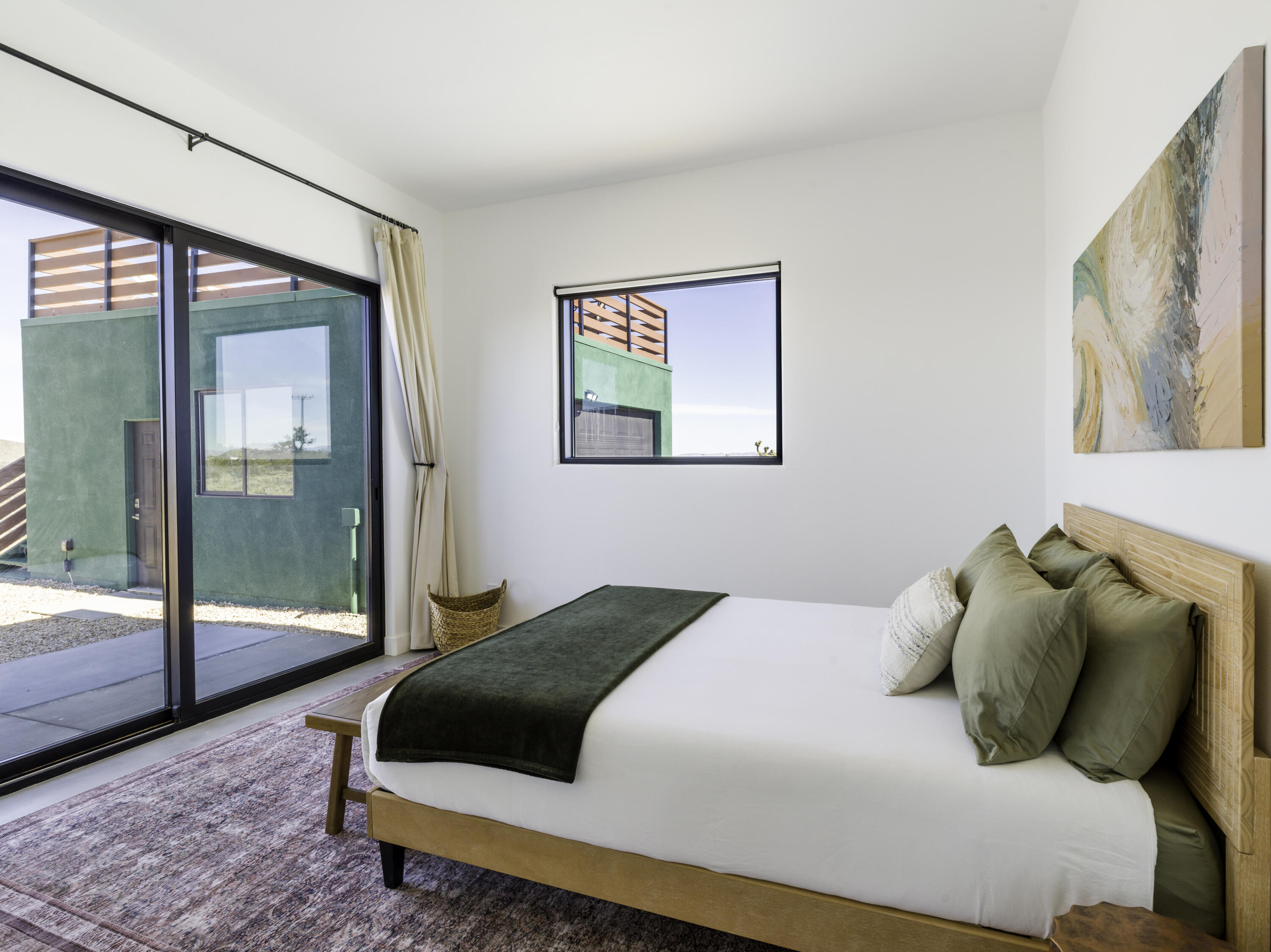 59130 Reche Road Landers, CA 92285 - Photo 31 of 69 a bedroom with a large bed and a large window