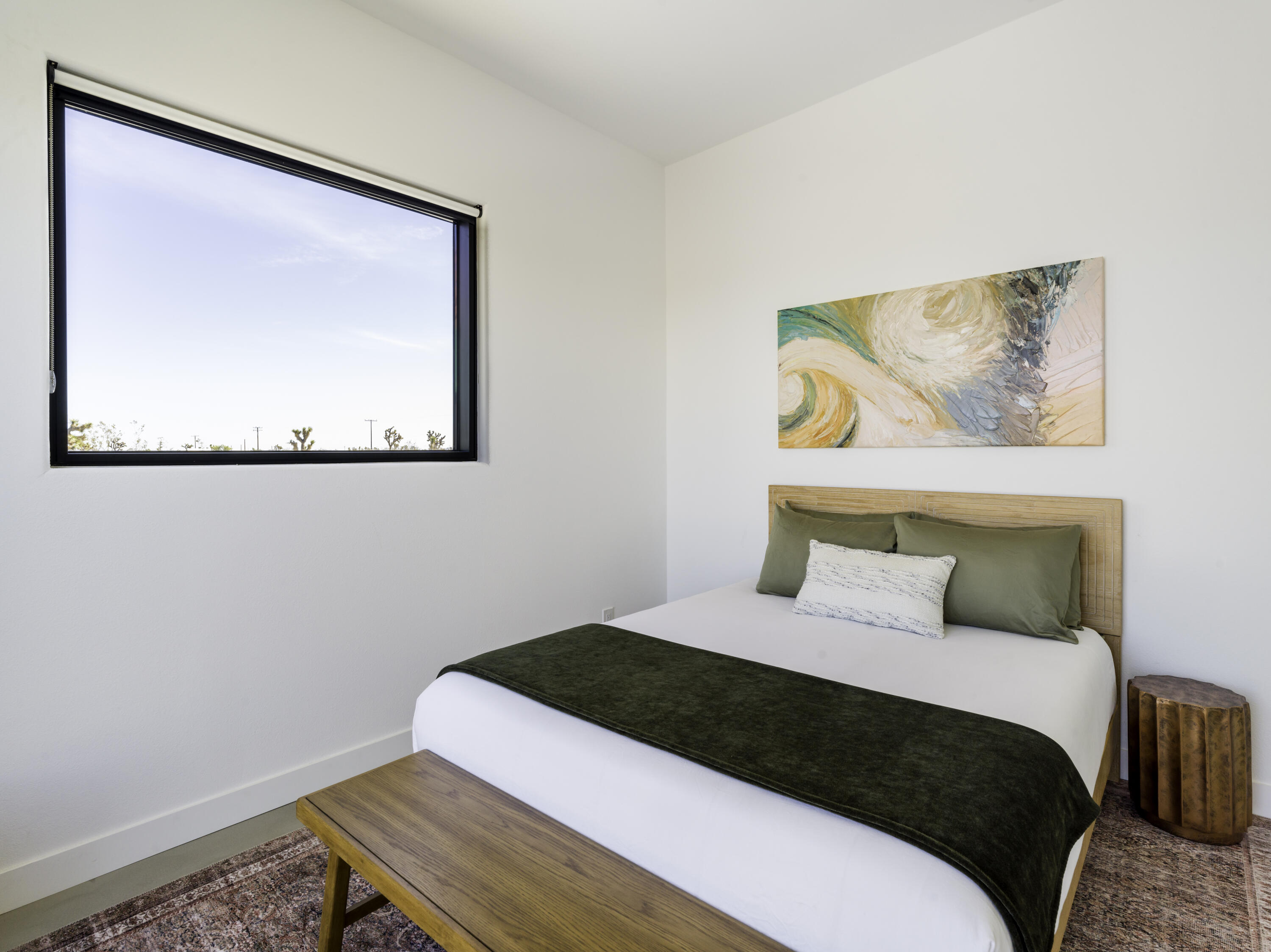 59130 Reche Road Landers, CA 92285 - Photo 33 of 69 a bedroom with a bed and a painting on the wall