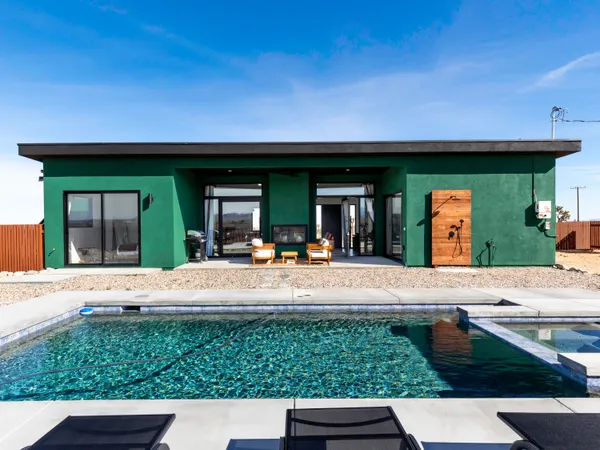 a front view of a house with swimming pool