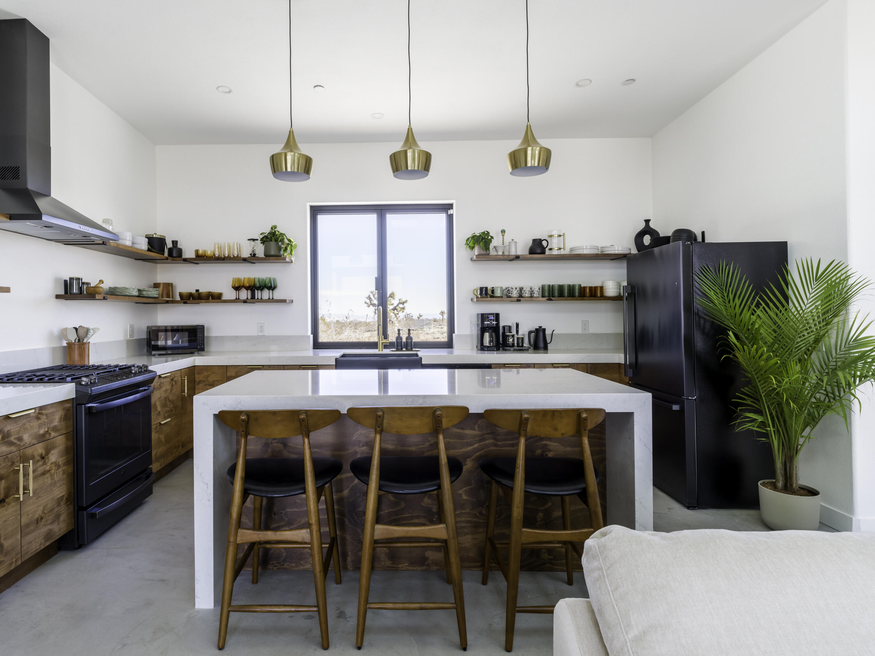 59130 Reche Road Landers, CA 92285 - Photo 6 of 69 a kitchen with a large window and stainless steel appliances