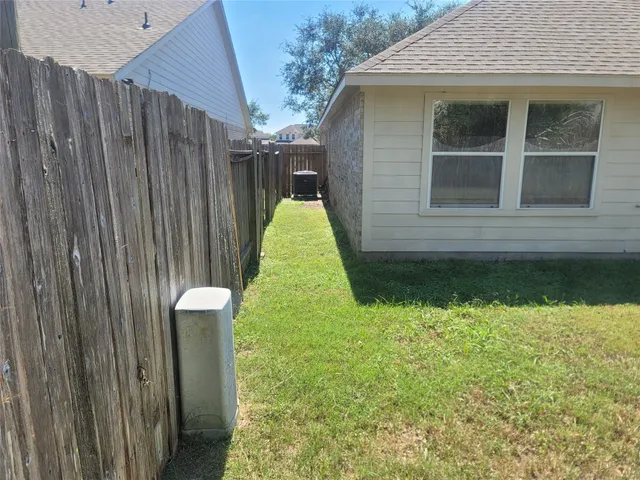 a house view with swimming pool and garden space