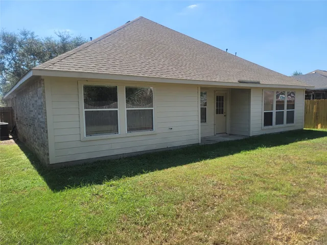 a house with yard in front of it
