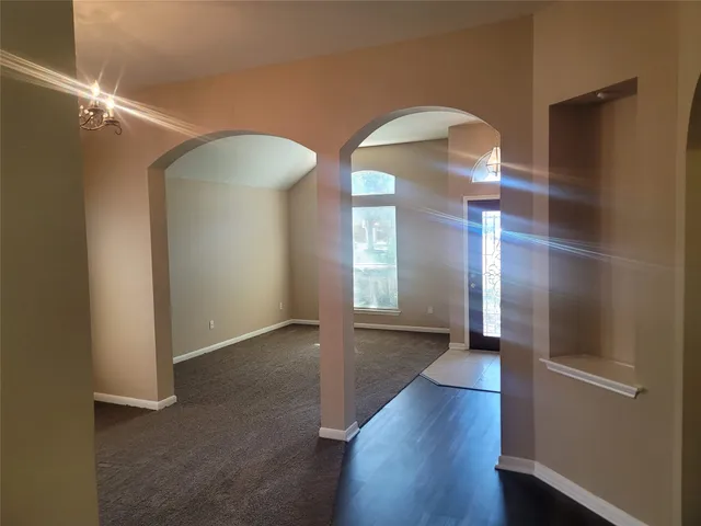a view of gallery with wooden floor