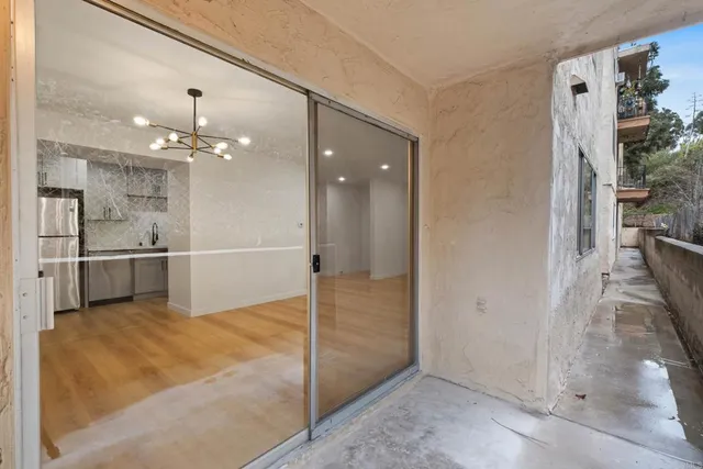 a view of a kitchen with a sink and a kitchen view