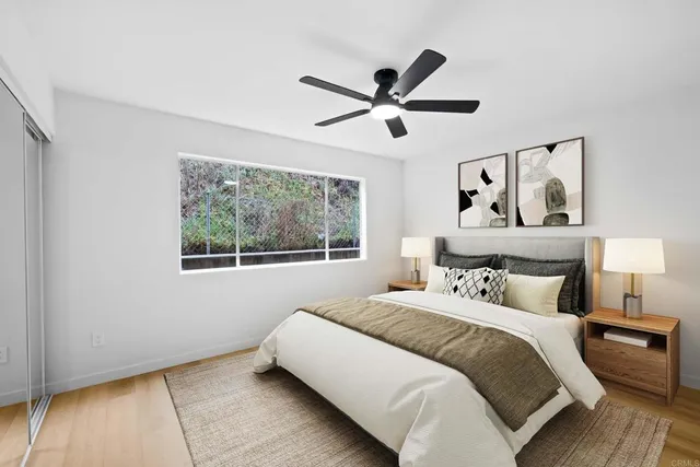 a bedroom with a bed and a window