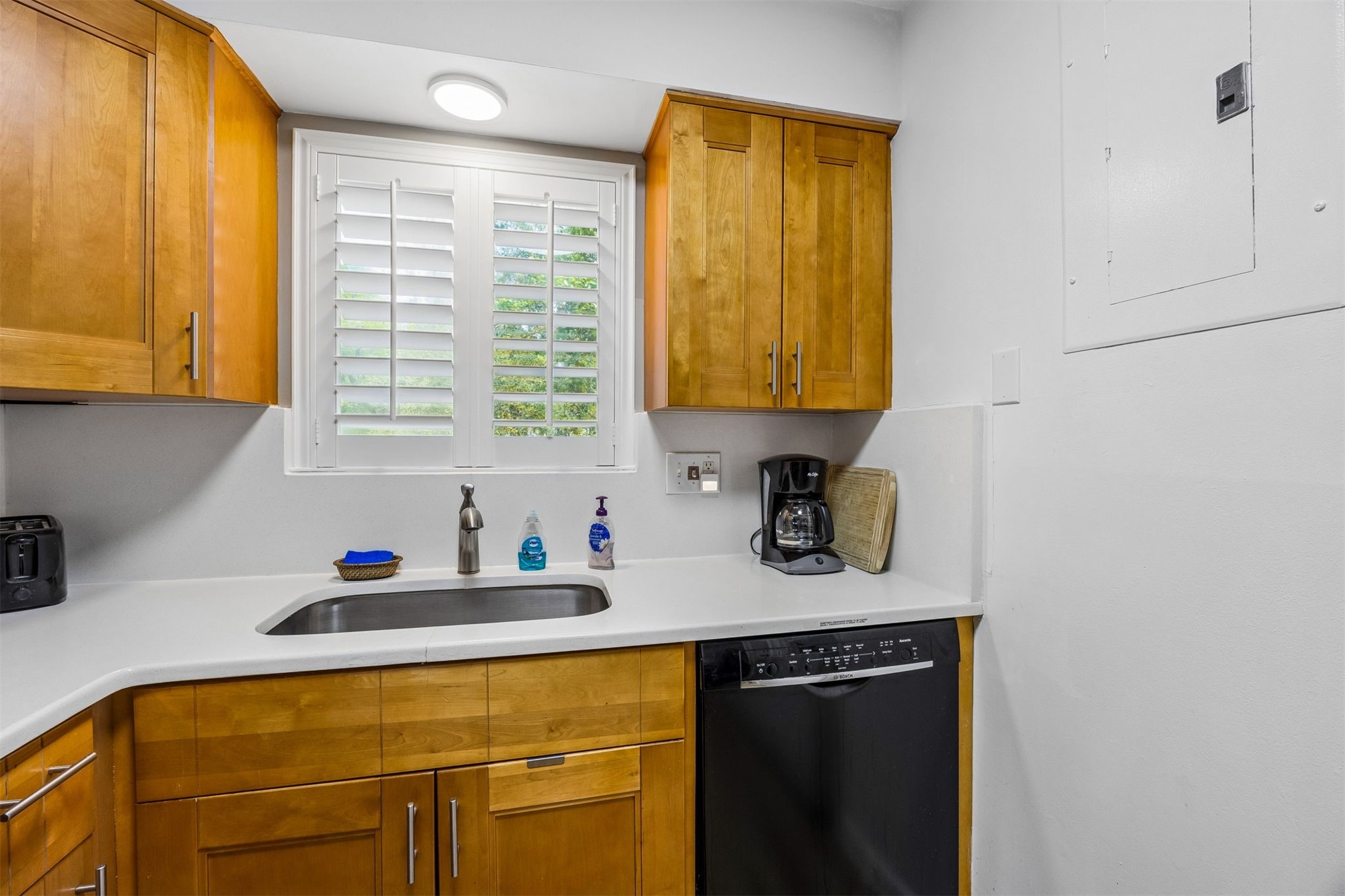 2328 Sadler Road, Unit 1C Fernandina Beach, FL 32034 - Photo 15 of 49 a kitchen with a sink cabinets and window