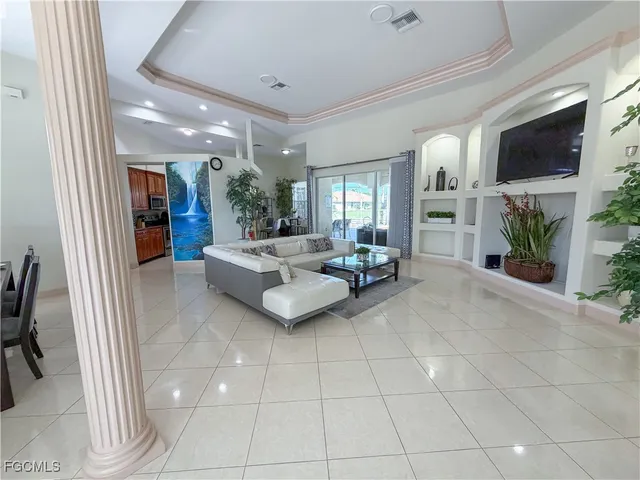 a living room with fireplace furniture and a flat screen tv