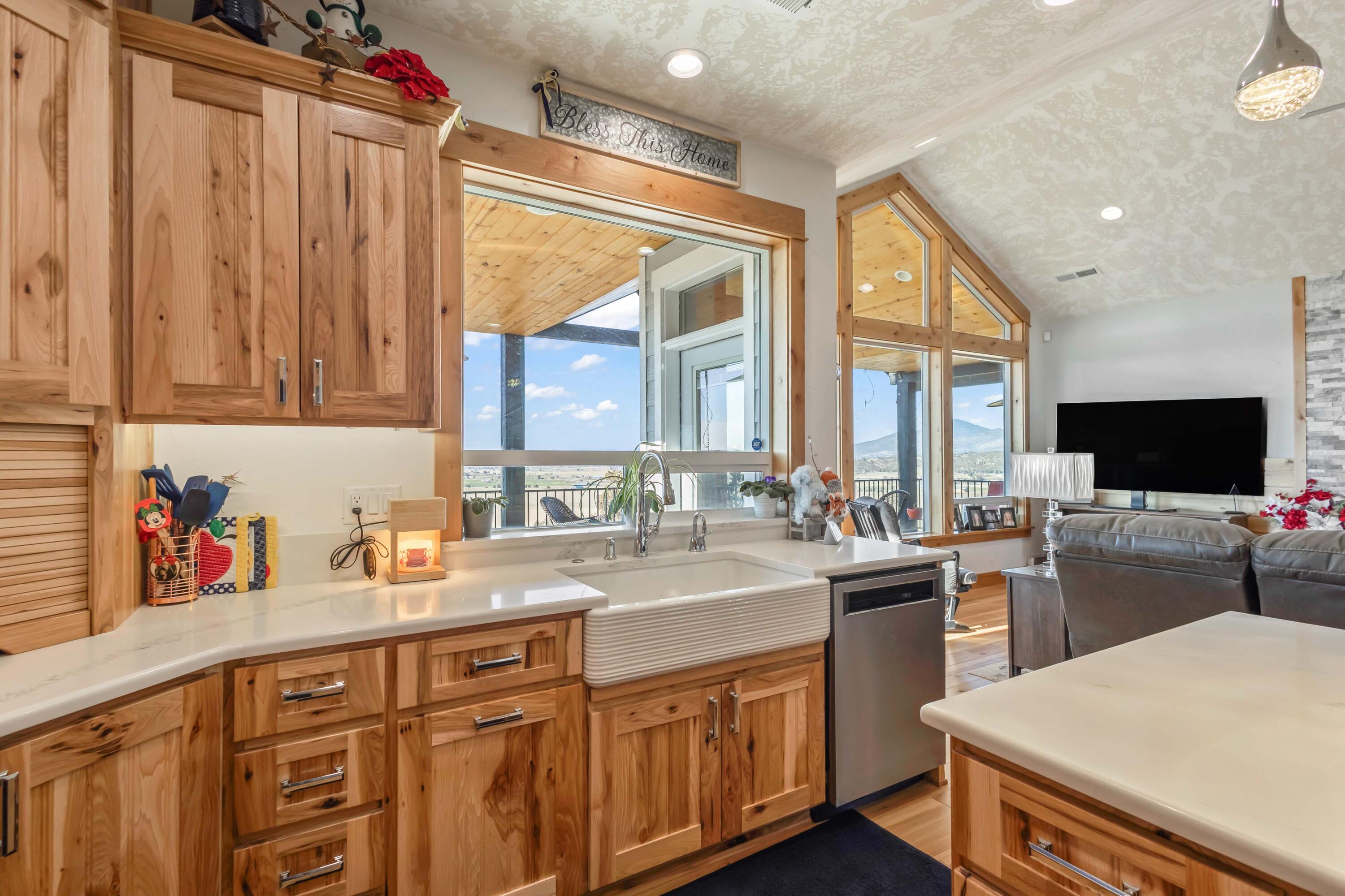5582 North Mckay Road Prineville, OR 97754 - Photo 14 of 54 a kitchen with a sink stove and cabinets