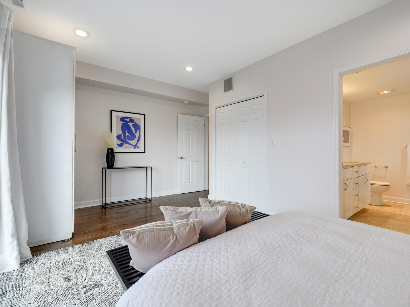 1404 North Mohawk Street, Unit 2 Chicago, IL 60610 - Photo 12 of 14 a bedroom with a bed and a potted plant on the dresser
