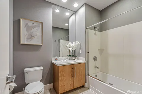 a bathroom with a toilet sink and shower