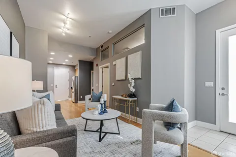 a living room with furniture and a table