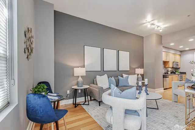 a living room with furniture and a table