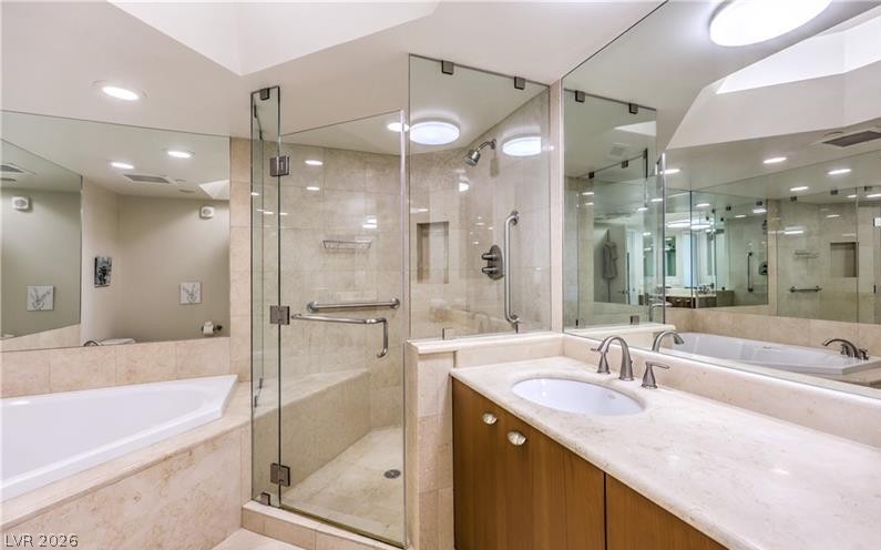 2777 Paradise Road, Unit 807 Las Vegas, NV 89109 - Photo 18 of 61 Marble finishes and a glass-enclosed shower create a spa-like retreat within this elegant bathroom.