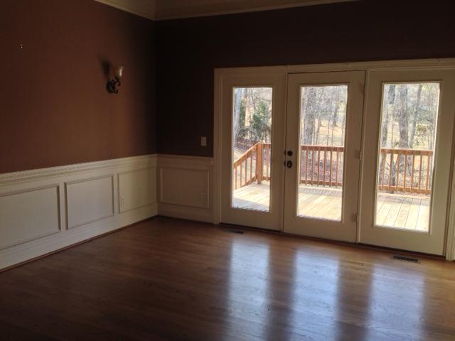 409 Sandcastle Road Franklin, TN 37069 - Photo 3 of 12 Could be a formal living room or family room. Lots of space to spread out in this home. Opens up to deck with incredible wooded view.