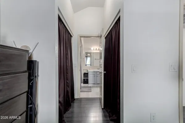 a bathroom with a shower curtain and a sink