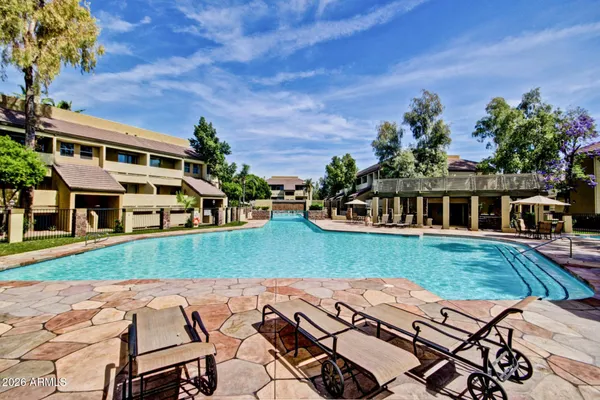 a view of a chairs and table in the garden