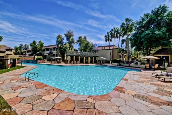 a view of a backyard with sitting area
