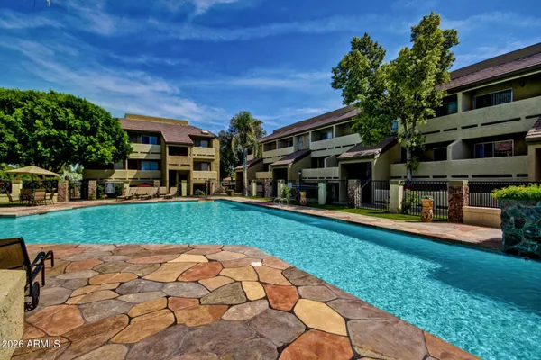 a view of a swimming pool with a patio