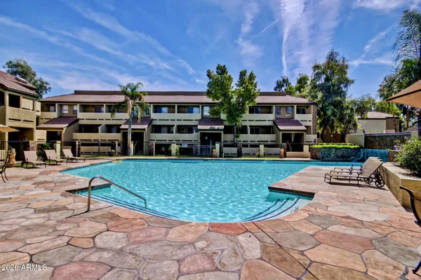 a view of a swimming pool with a patio