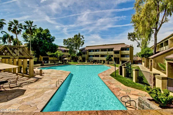 a front view of a house with a yard table and chairs
