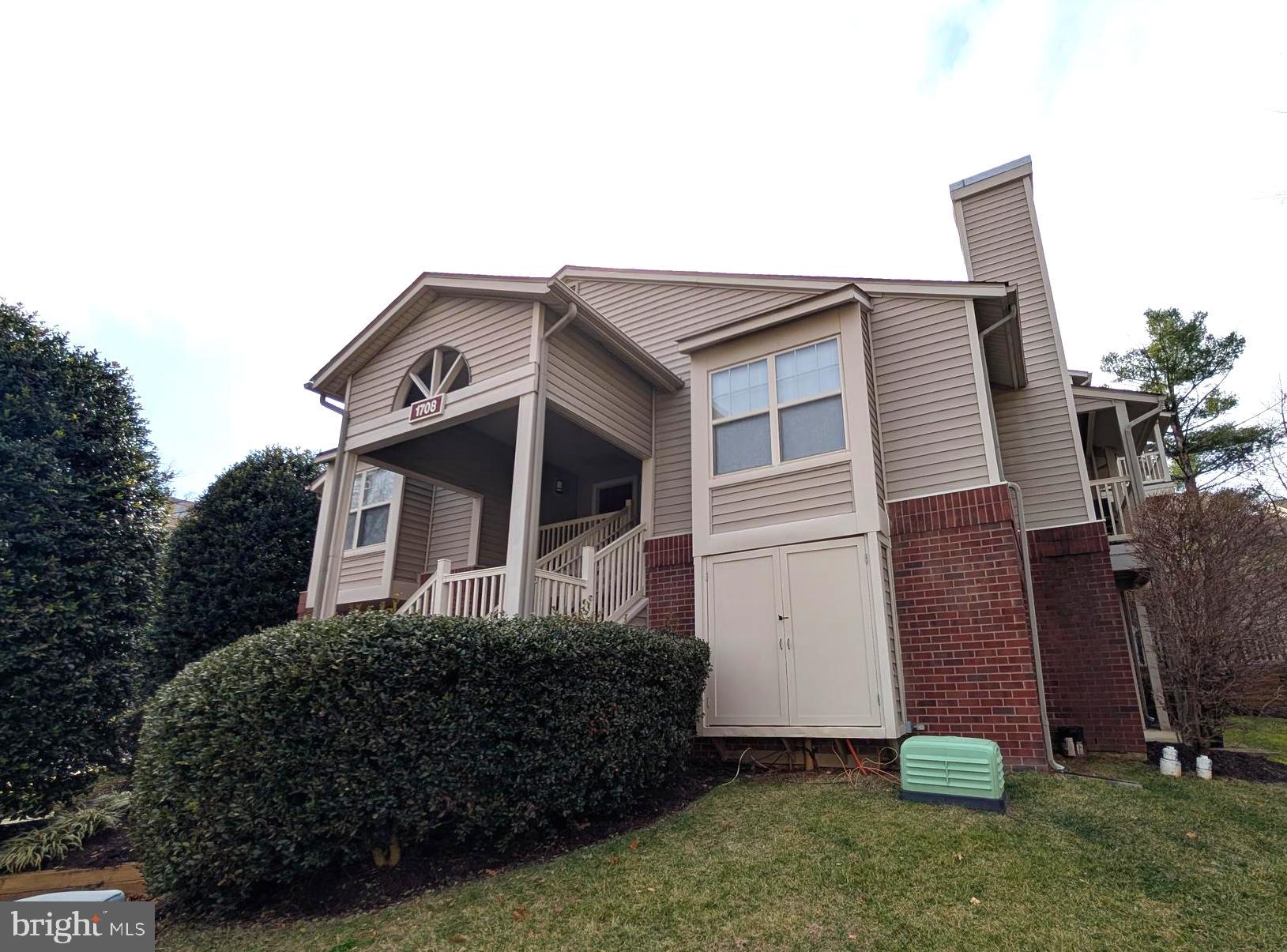 1708 Abercromby Court, Unit 1708B Reston, VA 20190 - Photo 1 of 26 a front view of a house with garden