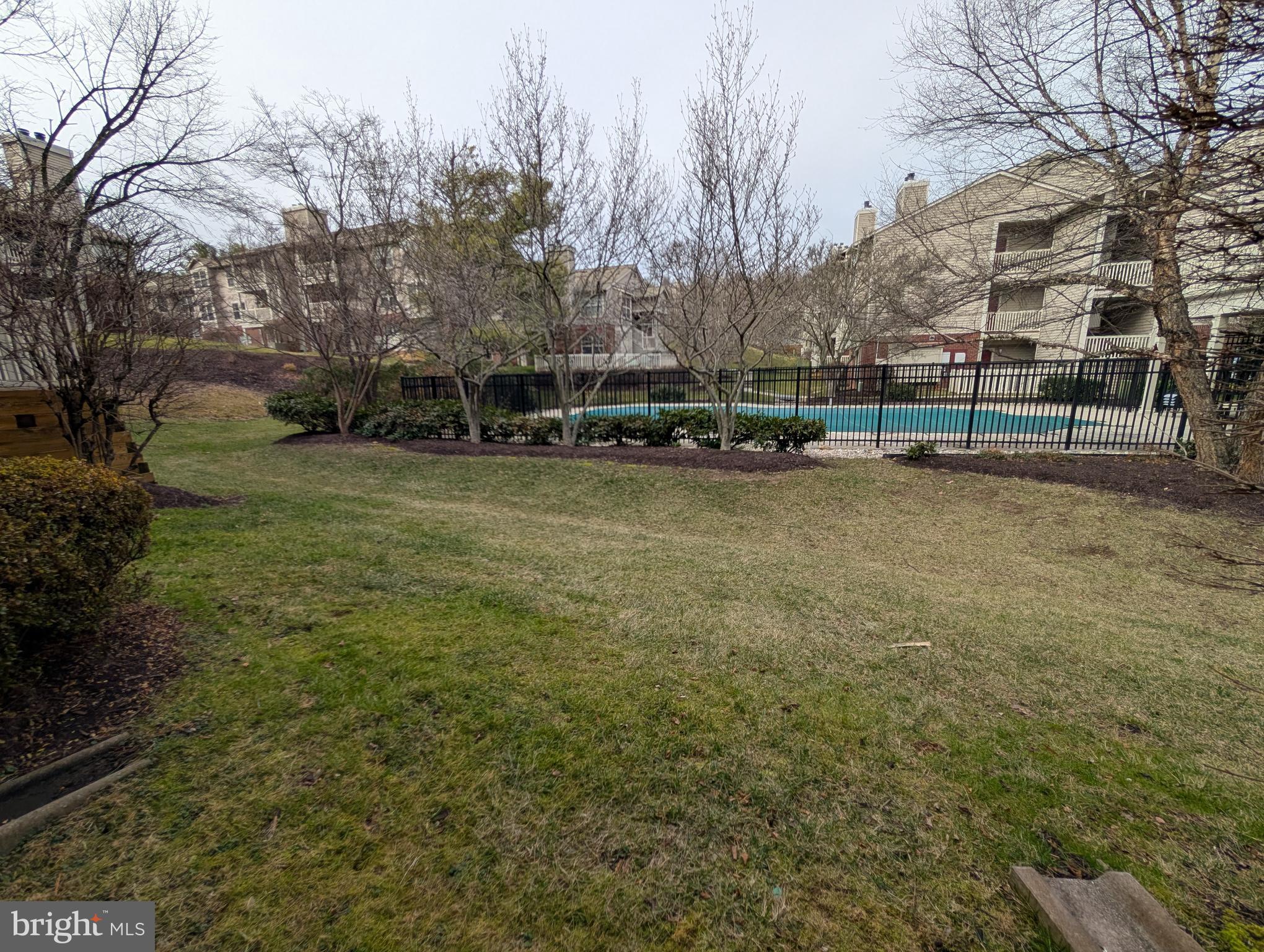 1708 Abercromby Court, Unit 1708B Reston, VA 20190 - Photo 16 of 26 a view of a field with trees on both side of it