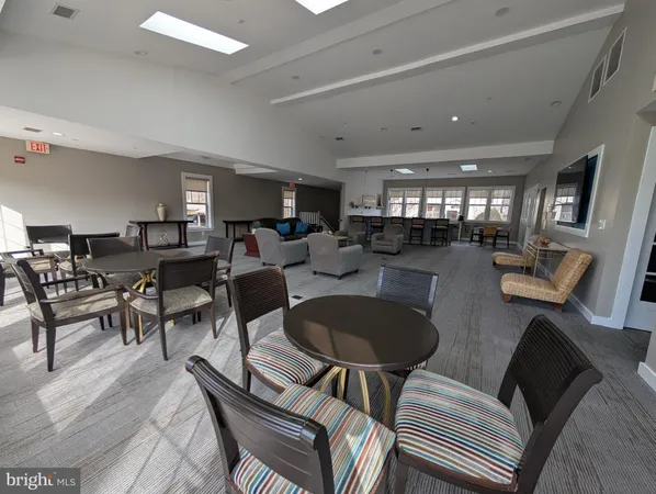 a living room with lots of furniture and a chandelier