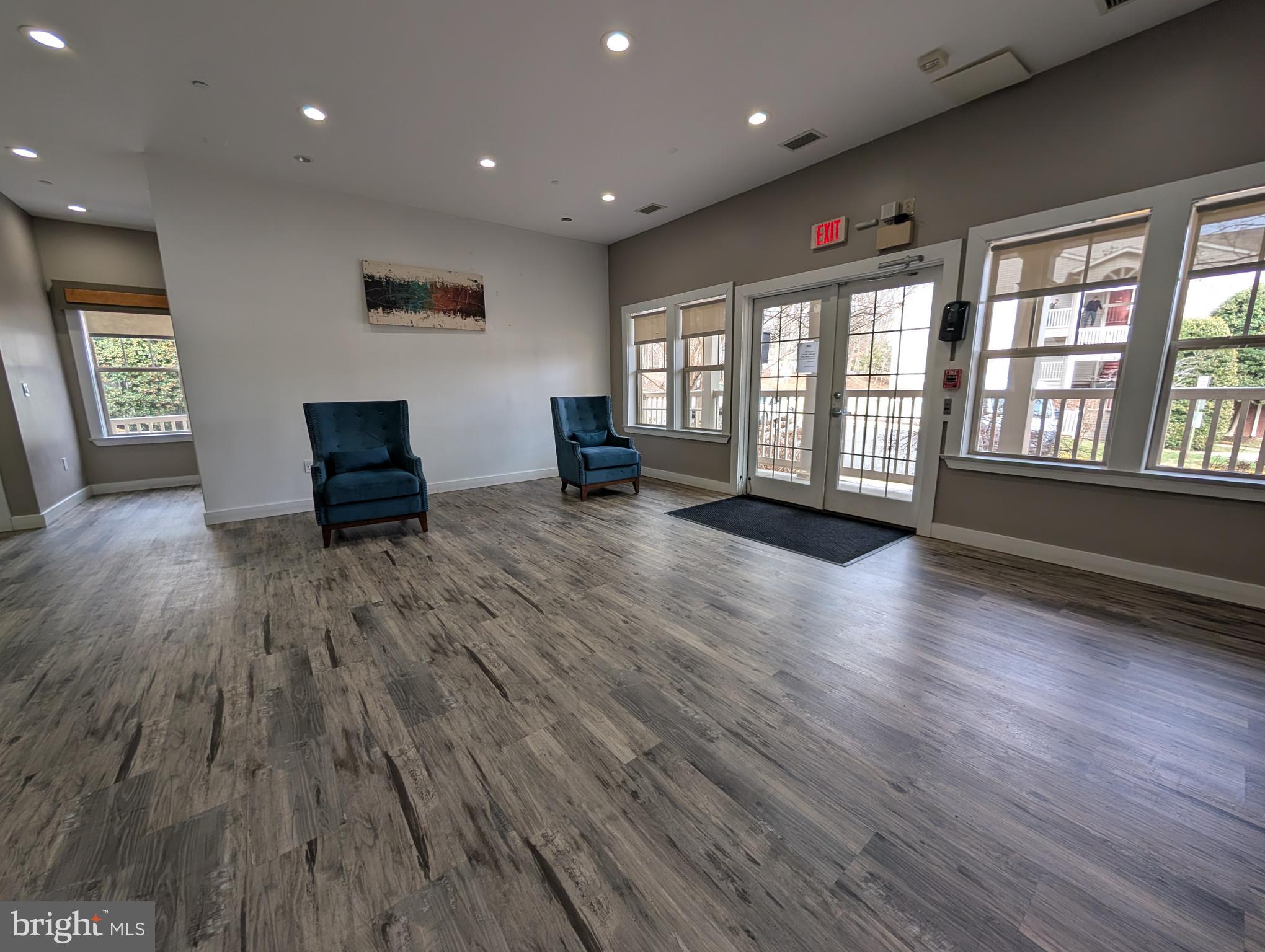 1708 Abercromby Court, Unit 1708B Reston, VA 20190 - Photo 25 of 26 an empty room with wooden floor and windows